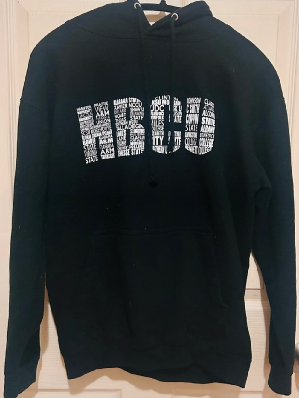 Source Unknown Black Hoodie with White Text Graphic